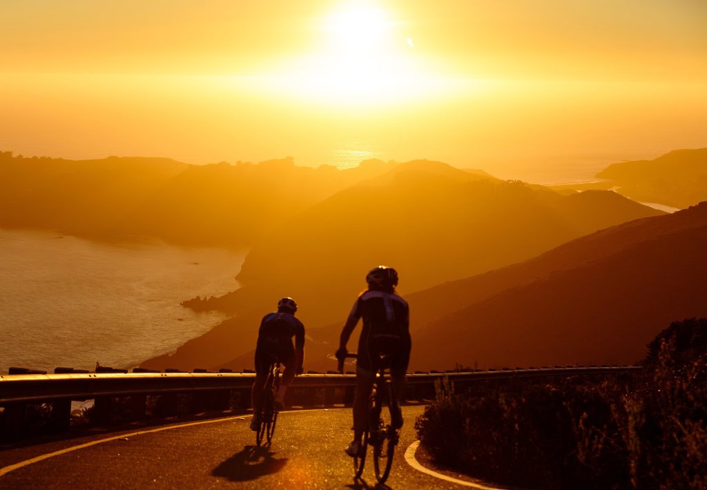 2 people cycling in the mountains